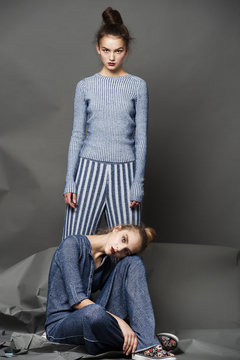 Fashion model pose on light background