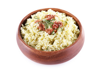 Rice with walnuts and rosemary in plate isolated on white