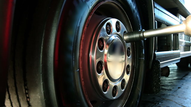 Close up shot of a truck tyre that is beig replaced