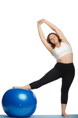 Fototapeta premium woman with extra weight makes slopes blue ball
