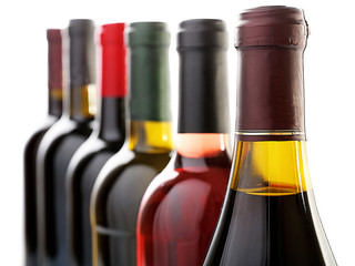 Wine bottles in row isolated on white