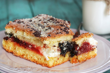 Homemade pie with jam, chocolate and glass of milk
