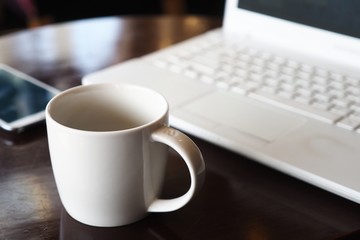 vintage color tone of  cup of coffee  on the table coffee shop