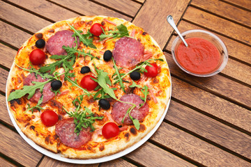 Delicious italian pizza served on wooden table