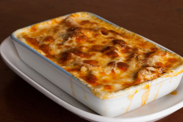 Baked penne pasta with tomato sauce and cheese