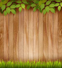 Naklejka premium Natural wooden background with leaves and grass. Vector.