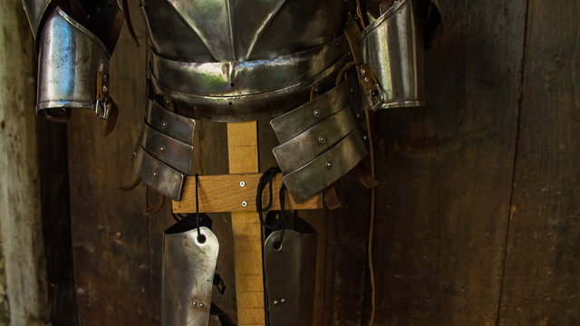 Medieval military armor on a wooden stand
