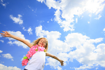 Obraz na płótnie Canvas A Little Blond Girl Fly High with sky on the background
