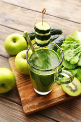 Green fresh healthy juice with fruits and vegetables
