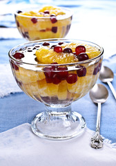 Dessert of orange slices and berries cranberries