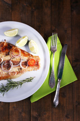 Dish of Pangasius fillet with spices and vegetables