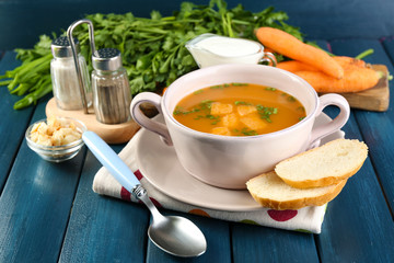 Composition with carrot soup, ingredients and herbs