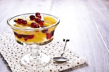 Dessert of orange slices and berries cranberries