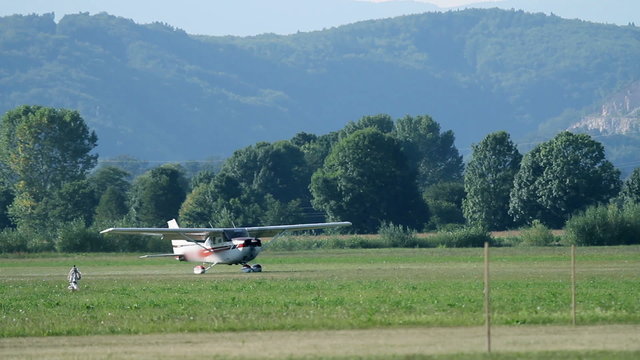 Small airplane turning around and taking off