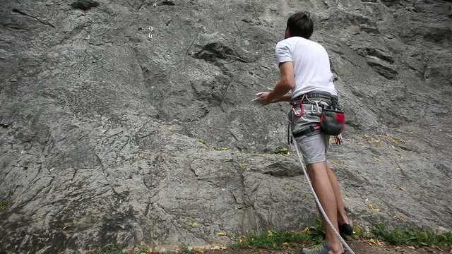 HD1080p: Man preparing for rock climbing in nature