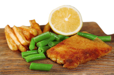 Breaded fried fish fillet and potatoes with asparagus and