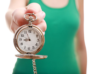 Silver pocket clock in hand close-up