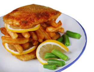 Breaded fried fillet and potatoes with asparagus and sliced