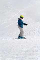 Fototapeta na wymiar Snowboarder on the mountain slope