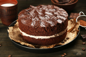 Delicious chocolate cake on table close-up