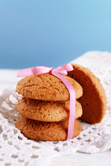 Tasty cookies on color wooden background