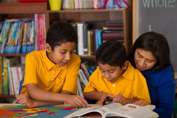 Hispanic Boys with Mom in Home-School Environment