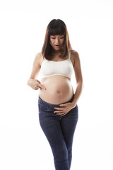 Asian pregnant woman point at her belly