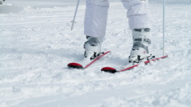 a youg girl who is skiing in the winter time