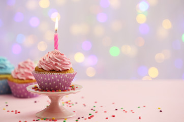 Delicious cupcakes on table on light background