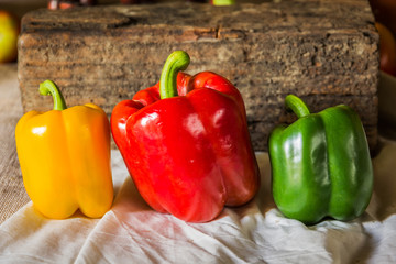 Still life with peppers, herbs, vegetables and fruits as an ingr