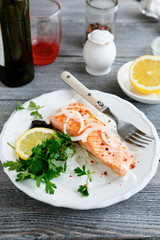 Tasty salmon with lemon on a plate