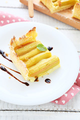 Piece of sweet pie with rhubarb on a plate