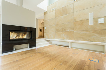 Burning fireplace in beige house