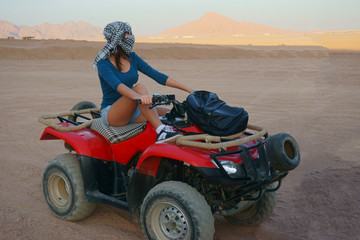 girl on quad in desert