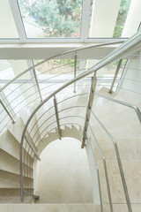 Fototapeta premium Spiral marble stairs in apartment