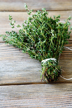 Bunch thyme on wooden boards
