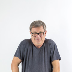 Obraz premium senior man in big eyeglasses smiling at camera. Copy space