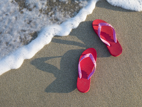 Beach sandals that has been forgotten in the sand