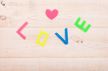 Word love on wooden background. Valentines Day