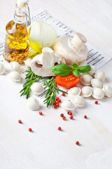 Tortellini and vegetables on white wooden background