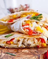 Mexican tortilla with meat stuffing, corn and vegetable salsa