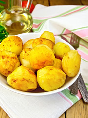 Naklejka na ściany i meble Potatoes fried on plate on table