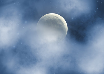 Fototapeta na wymiar Moon on a cloudy night with stars behind.