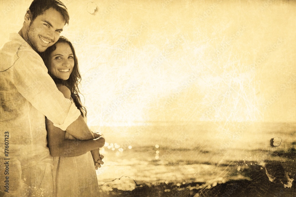 Aufkleber Composite image of smiling couple hugging and looking