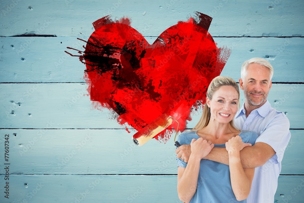 Poster composite image of happy couple hugging and holding paint roller