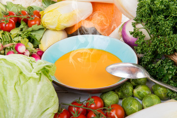 plate of pumpkin soup with vegetables