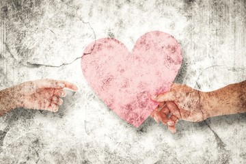 Composite image of couple passing a paper heart