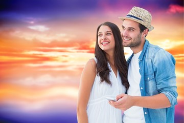 Obraz premium Composite image of happy hipster couple smiling together