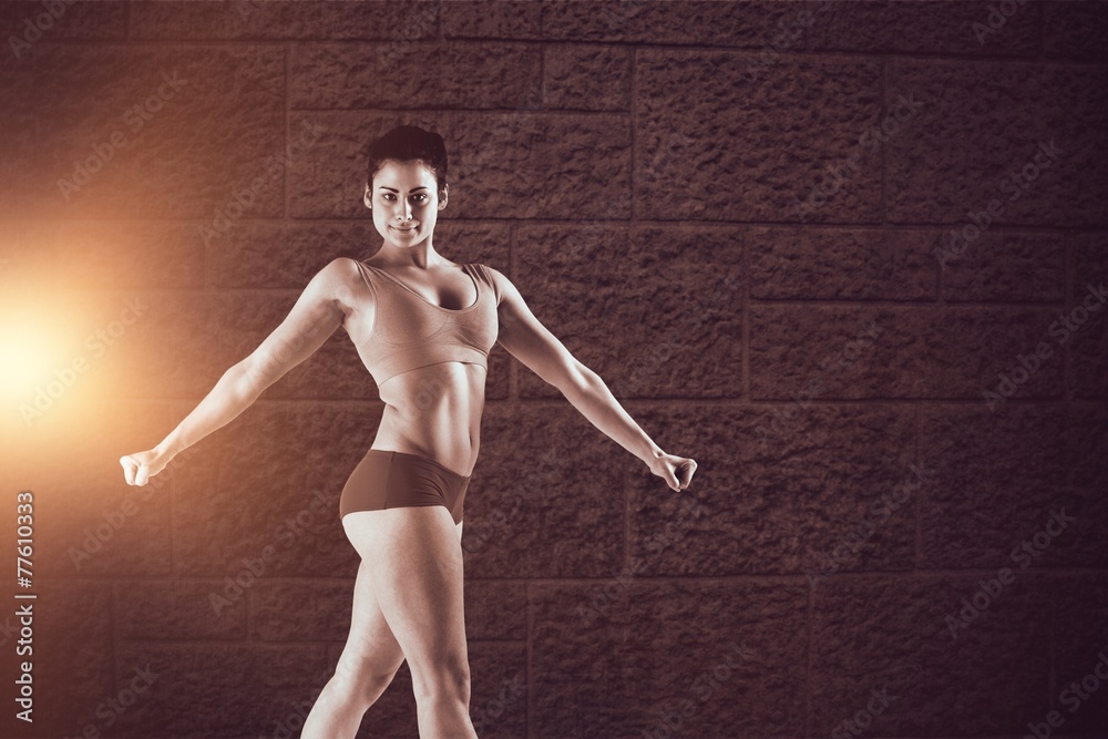 Poster composite image of fit brunette posing and looking at camera