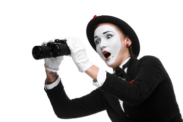 Fototapeta na wymiar Portrait of the surprised and joyful mime with binoculars
